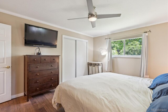 1774 S Dover Way, Lakewood, CO 80232 - bedroom with dark wood-style flooring, crown molding, a closet, and ceiling fan