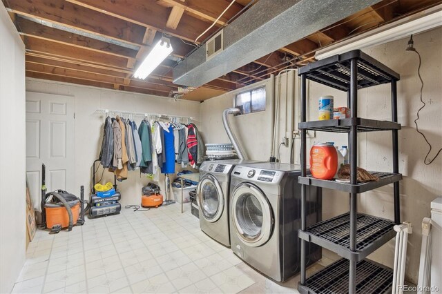 1774 S Dover Way, Lakewood, CO 80232 - laundry area with washer and clothes dryer