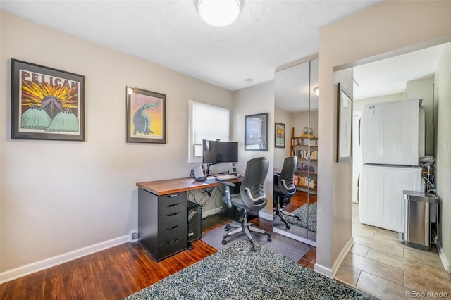 office featuring baseboards and wood finished floors