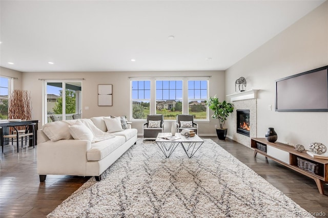 10387 Harrisburg St, Parker, CO 80134 - living room featuring recessed lighting, dark wood-style flooring, and a tile fireplace