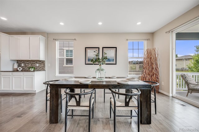 10387 Harrisburg St, Parker, CO 80134 - dining room featuring light wood finished floors and recessed lighting