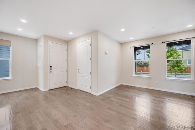 10387 Harrisburg St, Parker, CO 80134 - entrance foyer with light wood-style flooring and recessed lighting