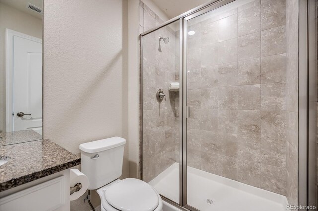 10387 Harrisburg St, Parker, CO 80134 - full bathroom featuring vanity, a shower stall, and a textured wall