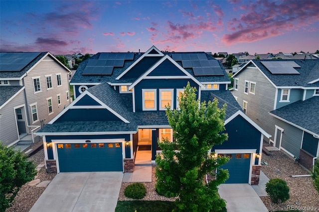 10387 Harrisburg St, Parker, CO 80134 - craftsman-style house with stone siding, driveway, a shingled roof, a residential view, and roof mounted solar panels
