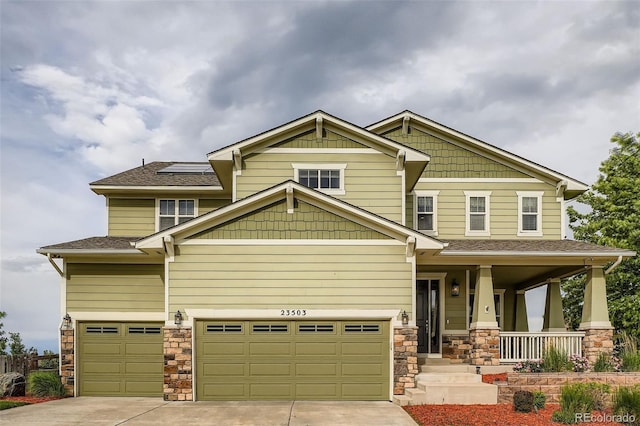 23503 E Minnow Dr, Aurora, CO 80016 - craftsman inspired home featuring covered porch, stone siding, concrete driveway, an attached garage, and roof with shingles