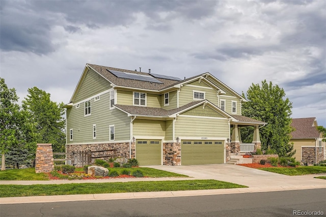 23503 E Minnow Dr, Aurora, CO 80016 - craftsman-style home featuring an attached garage, solar panels, driveway, and stone siding