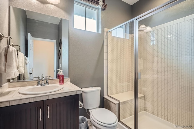 23503 E Minnow Dr, Aurora, CO 80016 - full bath featuring a textured wall, vanity, and a stall shower