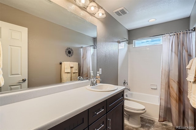 23503 E Minnow Dr, Aurora, CO 80016 - bathroom with vanity, shower / bath combo with shower curtain, and a textured wall