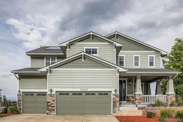 23503 E Minnow Dr, Aurora, CO 80016 - craftsman inspired home with covered porch, stone siding, concrete driveway, and a garage
