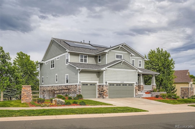 23503 E Minnow Dr, Aurora, CO 80016 - craftsman inspired home with a garage, solar panels, concrete driveway, and stone siding