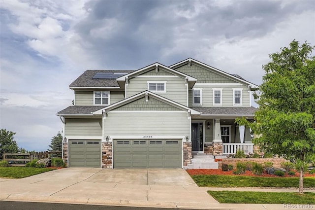23503 E Minnow Dr, Aurora, CO 80016 - craftsman-style house with a porch, a garage, solar panels, driveway, and roof with shingles
