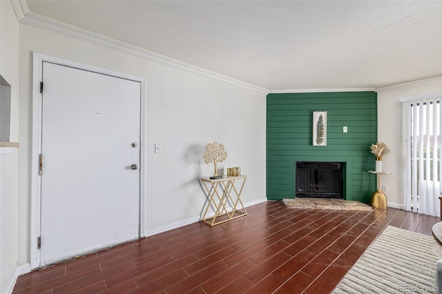 living room featuring dark hardwood / wood-style flooring and ornamental molding