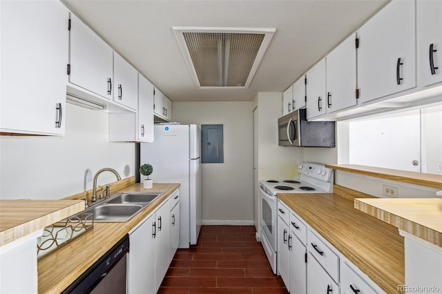 kitchen featuring white cabinets, dark hardwood / wood-style floors, and stainless steel appliances