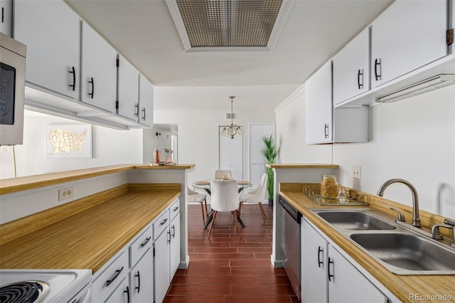 kitchen with white cabinetry, sink, stainless steel appliances, dark hardwood / wood-style flooring, and decorative light fixtures