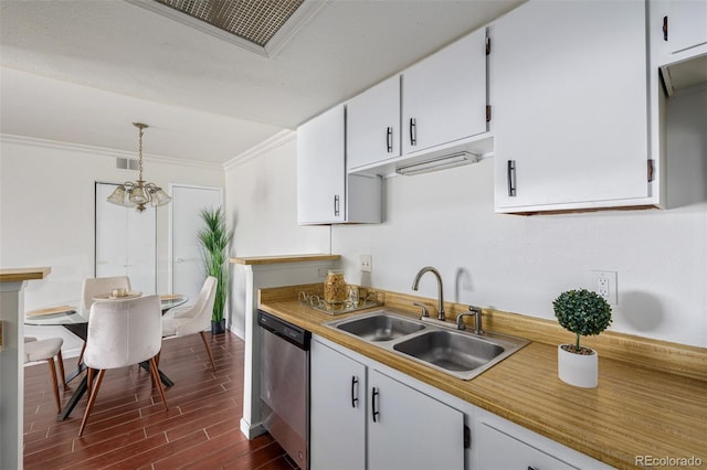 kitchen featuring dark wood-type flooring, sink, decorative light fixtures, dishwasher, and white cabinetry