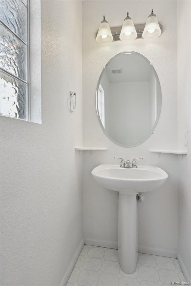 1272 Braewood Ave, Highlands Ranch, CO 80129 - bathroom with baseboards