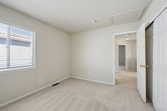 1272 Braewood Ave, Highlands Ranch, CO 80129 - spare room with light colored carpet, attic access, baseboards, and a smoke detector