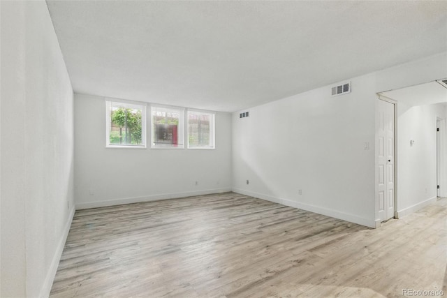 7755 E Quincy Ave Unit 107D2, Denver, CO 80237 - empty room featuring light wood-style flooring and baseboards