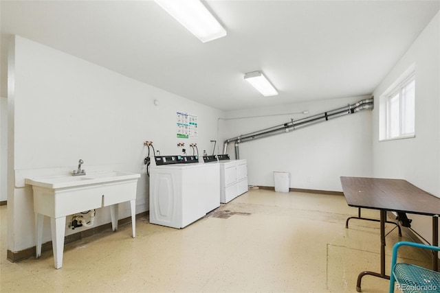 7755 E Quincy Ave Unit 107D2, Denver, CO 80237 - community laundry room featuring washer and dryer and baseboards