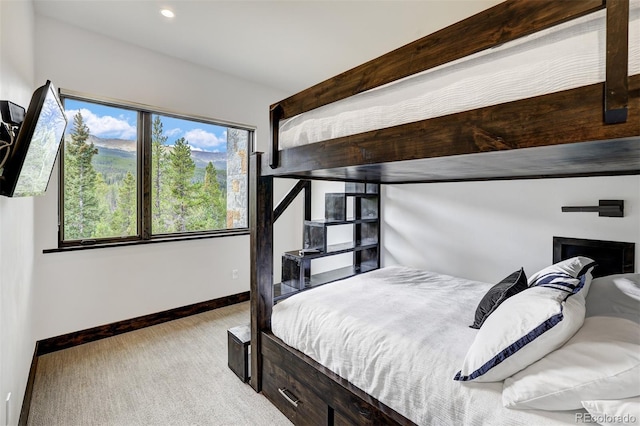 bedroom featuring light carpet