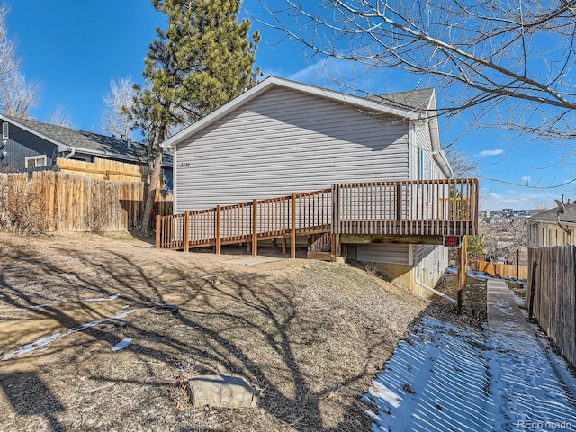 back of property featuring a deck