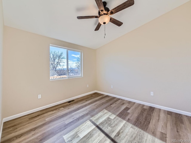 empty room with light wood-type flooring and ceiling fan