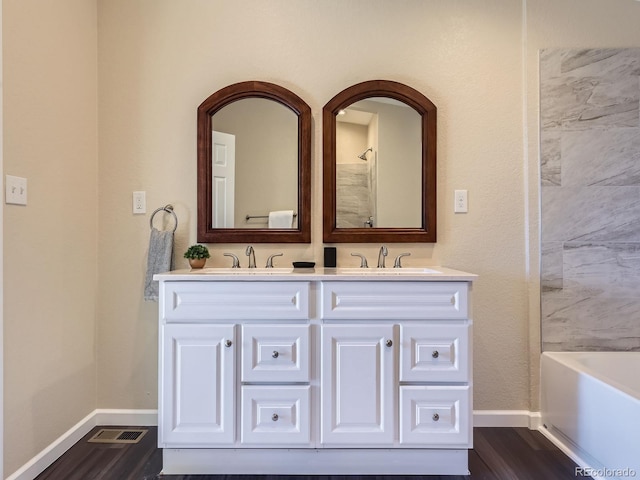 bathroom with wood-type flooring and vanity