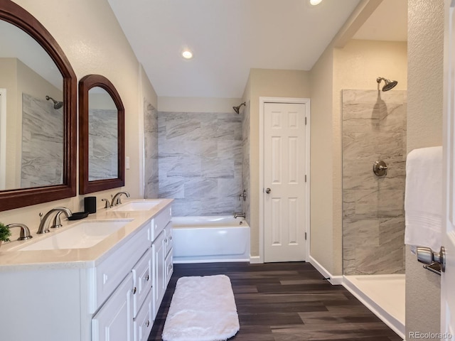 bathroom featuring shower with separate bathtub, vanity, and hardwood / wood-style flooring