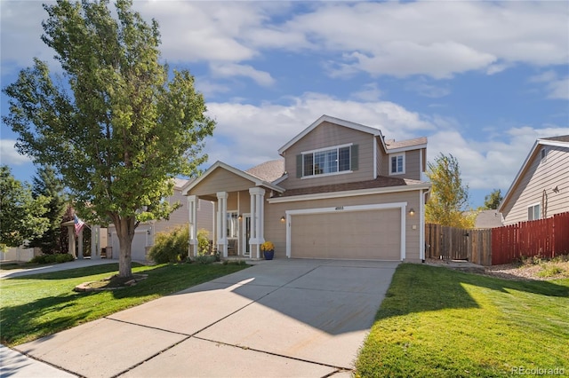 view of front of home featuring a garage and a front lawn