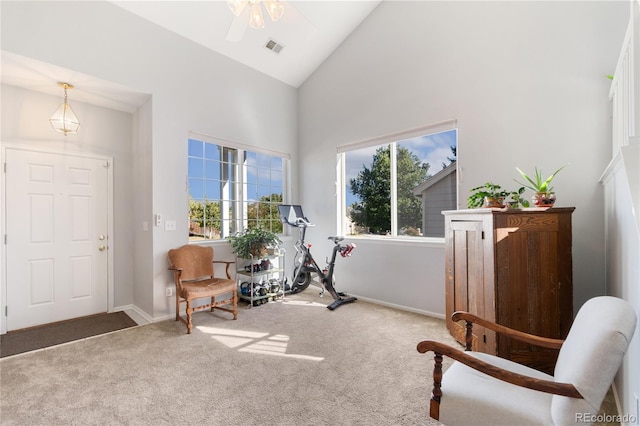 sitting room with carpet, high vaulted ceiling, a wealth of natural light, and ceiling fan