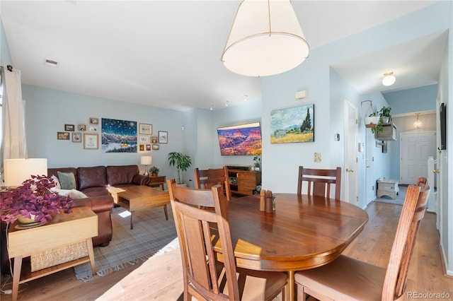 dining area with light hardwood / wood-style flooring