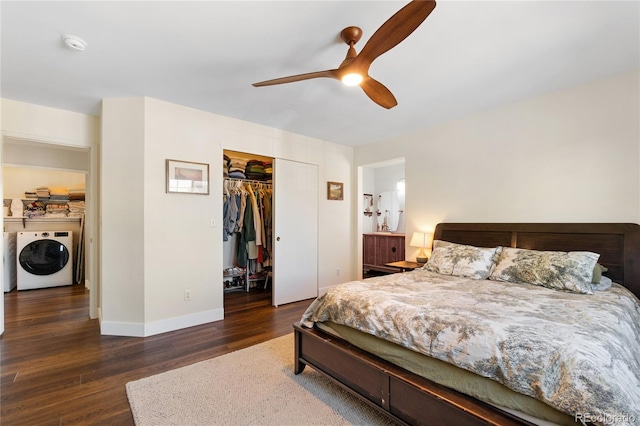 bedroom with dark hardwood / wood-style floors, ceiling fan, washing machine and clothes dryer, and a closet