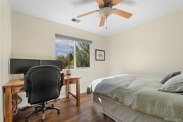 bedroom featuring ceiling fan and dark wood-type flooring