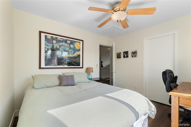 bedroom with ceiling fan and dark wood-type flooring