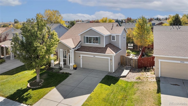 view of front property with a garage and a front lawn