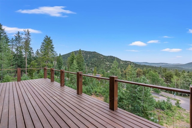 wooden deck featuring a mountain view