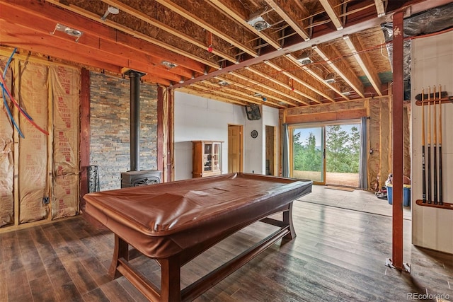 playroom featuring hardwood / wood-style floors, a wood stove, and pool table