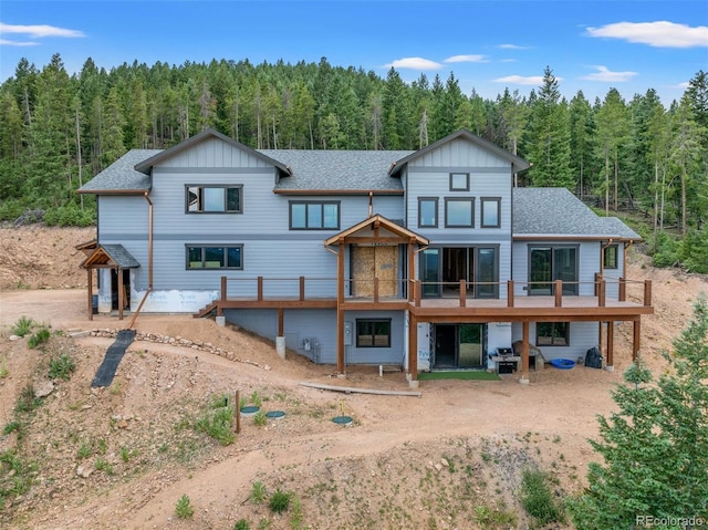 back of house featuring a deck