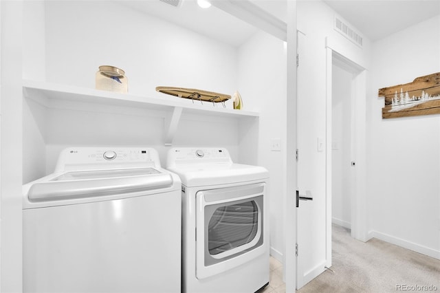 5387 Pierson Ct, Wheat Ridge, CO 80033 - laundry area featuring separate washer and dryer, baseboards, and light colored carpet