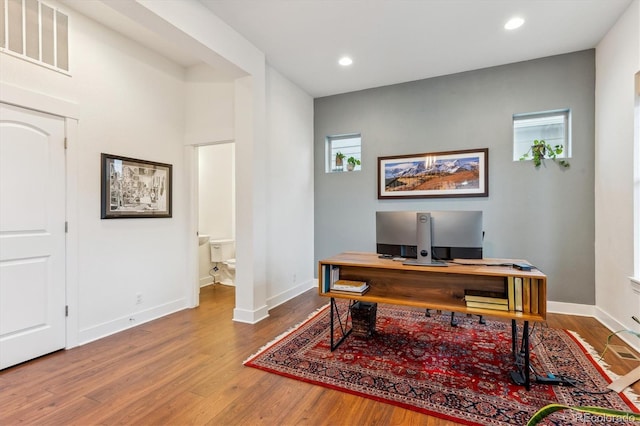 office area featuring wood finished floors, baseboards, and recessed lighting