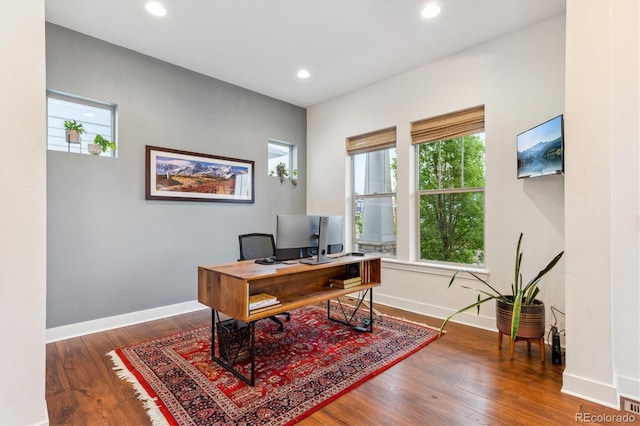 office space with wood finished floors, baseboards, and recessed lighting