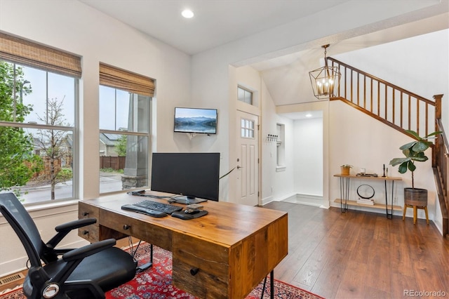 office featuring healthy amount of natural light, hardwood / wood-style flooring, recessed lighting, a chandelier, and baseboards