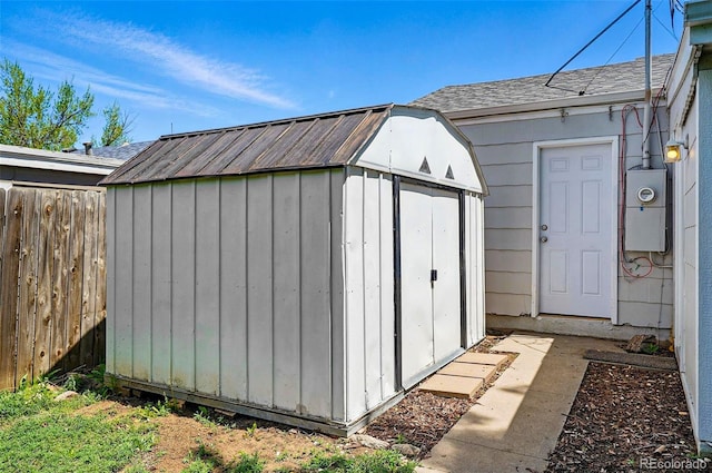 view of shed with fence