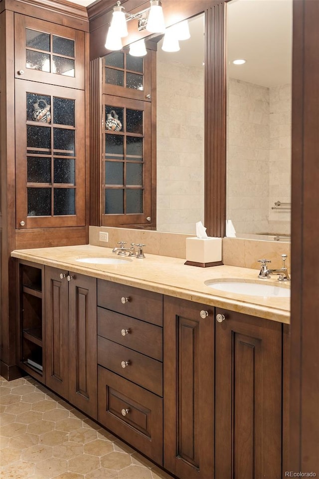 bathroom with tile patterned flooring and vanity