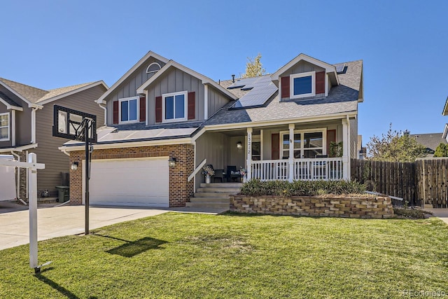 view of front of house with brick siding, a porch, board and batten siding, roof mounted solar panels, and driveway