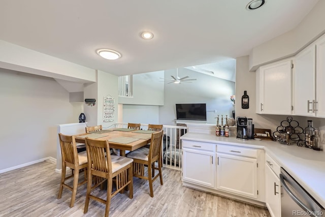 interior space featuring light wood-style flooring, baseboards, and ceiling fan