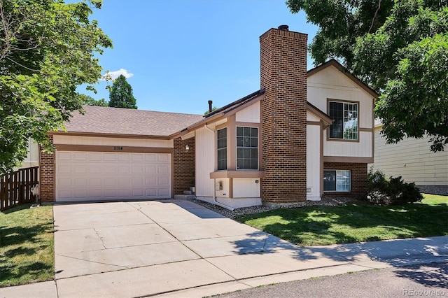 9194 Hickory Cir, Highlands Ranch, CO 80126 - view of front of property with a chimney, an attached garage, driveway, and brick siding