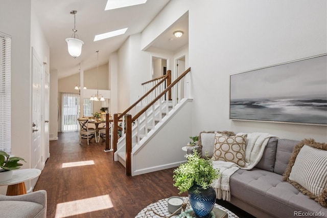 9194 Hickory Cir, Highlands Ranch, CO 80126 - living area with wood finished floors, stairway, a chandelier, a skylight, and high vaulted ceiling