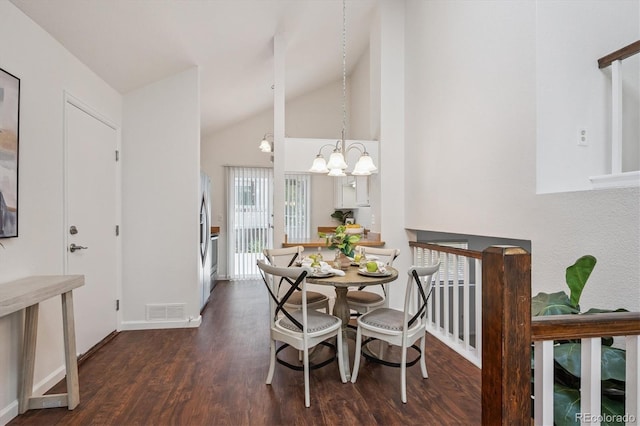 9194 Hickory Cir, Highlands Ranch, CO 80126 - dining room with wood finished floors, a chandelier, and high vaulted ceiling