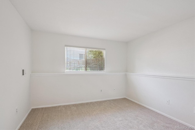 9194 Hickory Cir, Highlands Ranch, CO 80126 - carpeted spare room featuring baseboards